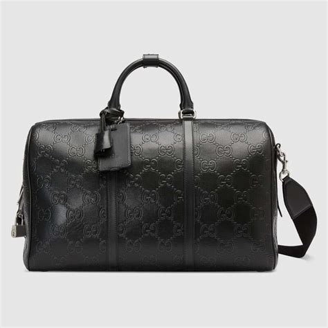 gucci black unisex canvas duffle bag|gucci embossed duffle bag.